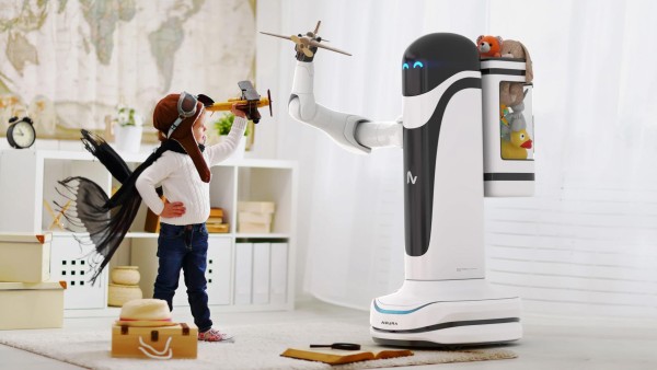 EIn Kind steht vor einem Roboter von Neura