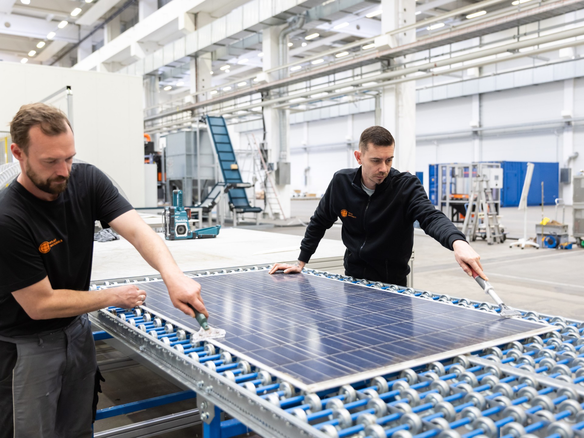 SOLAR MATERIALS employees in the recycling process.