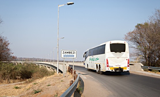 An overland bus crosses the bridge