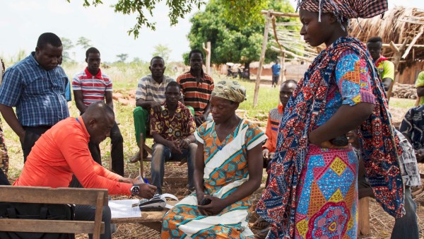 People in a village in Ghana using e-zwich