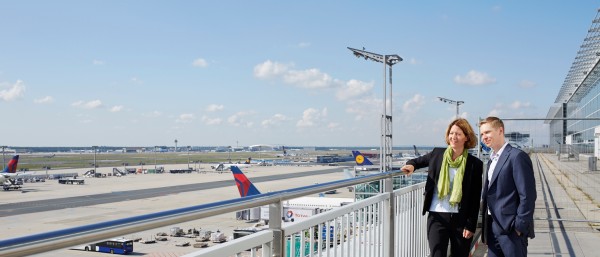 two people looking at the airfield