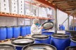 Site manager Tobias Franke in the warehouse with coffee barrels