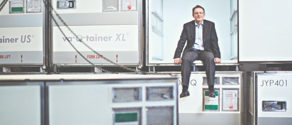 CEO Joachim Kuhn sits in an open va-Q-tainer