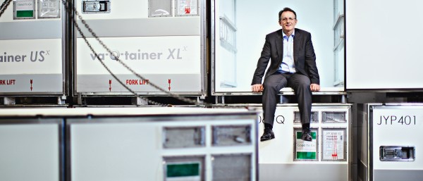 CEO Joachim Kuhn sits in an open va-Q-tainer